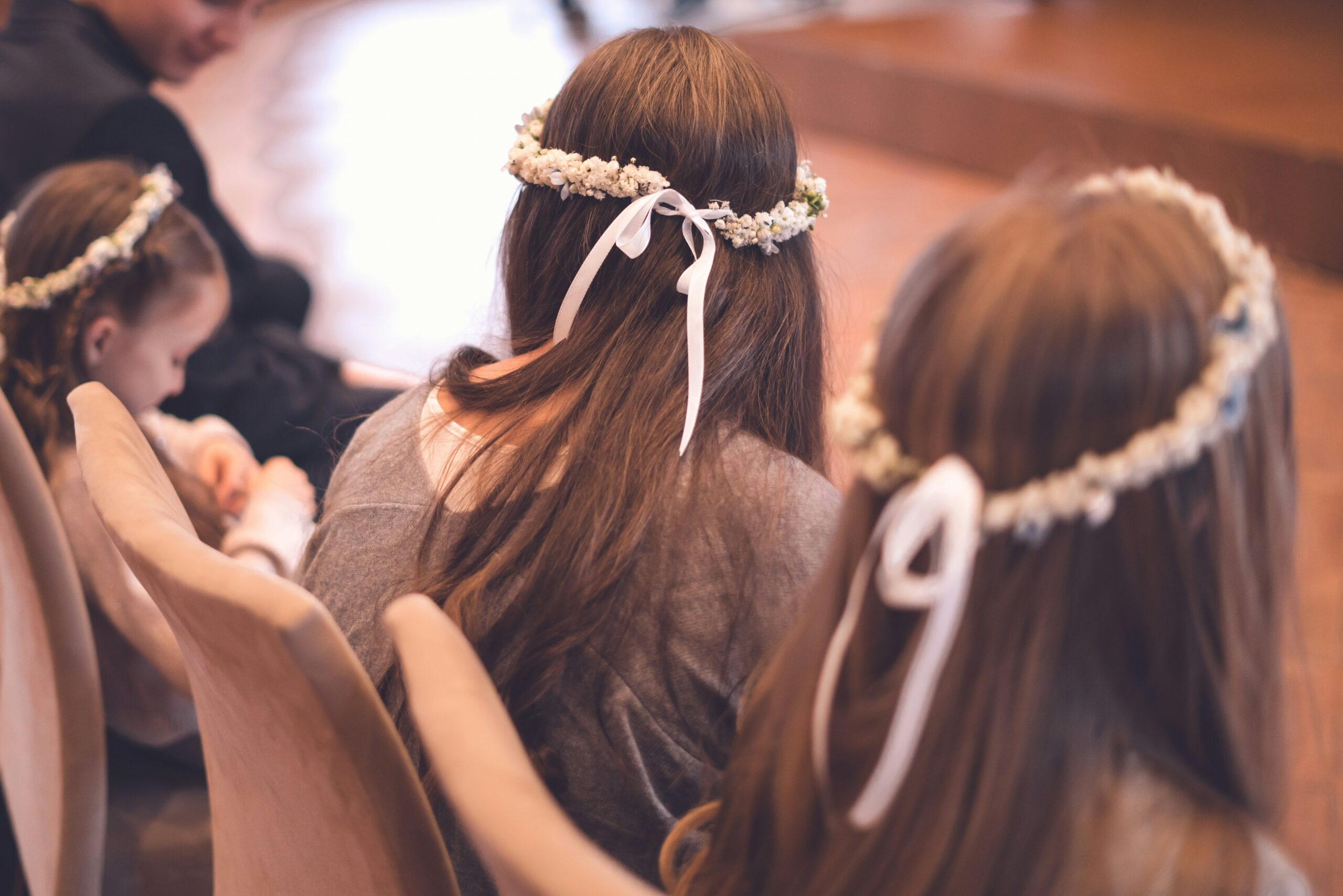 A young woman confidently wearing a secure prom hair crown