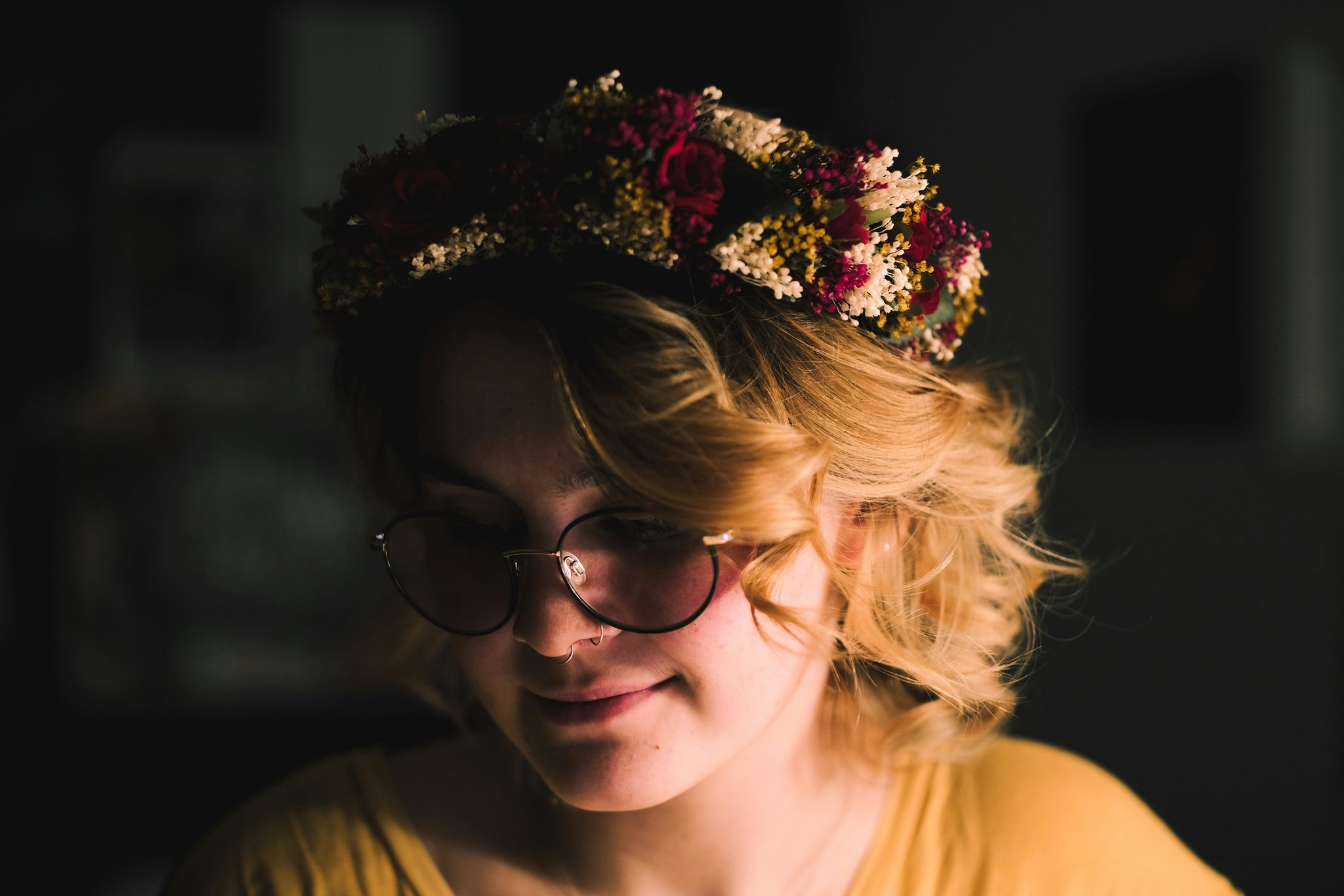 A woman wearing a vintage-inspired floral crown at a summer festival