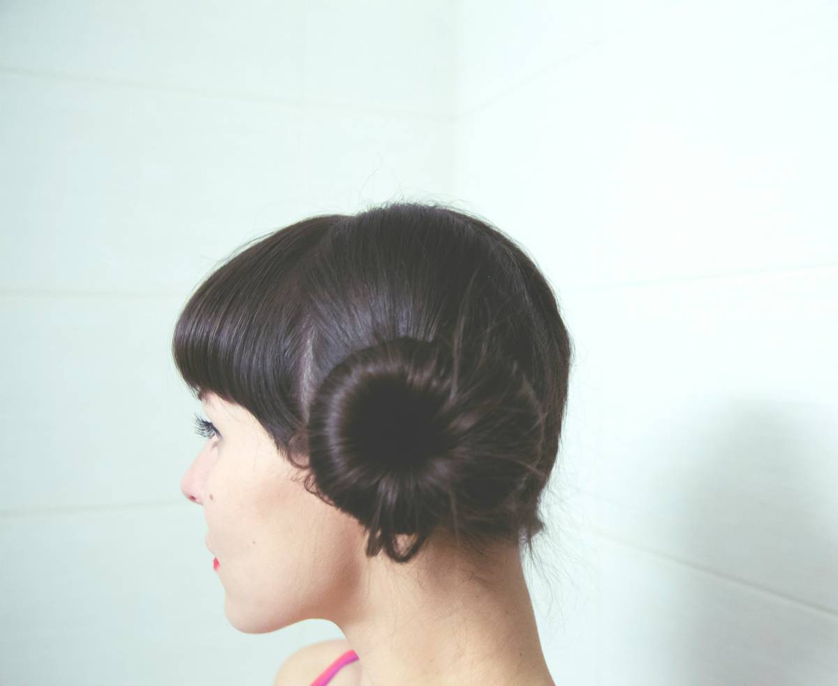 A close-up image demonstrating proper placement of a hair crown