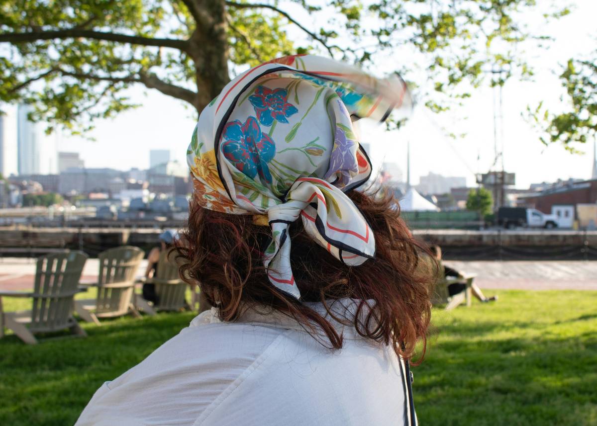 Close-up image of a beautifully styled crown on flowing brunette hair.