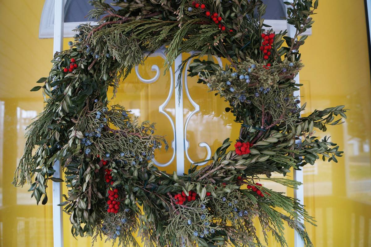 Close-up shot of hands crafting a custom-made gold-colored crown