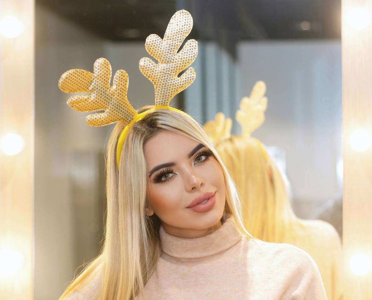 A beautifully crafted silver tiara adorned with sparkling crystals, perfect for any elegant event.