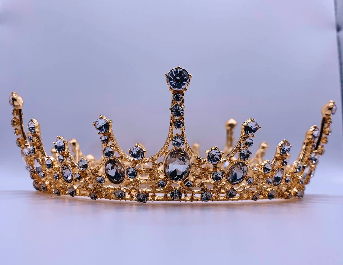 A dazzling carnival tiara featuring gold accents and colorful gemstones